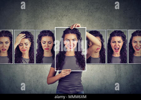 Junge Frau zum Ausdruck bringen verschiedene Emotionen maskiert Stockfoto