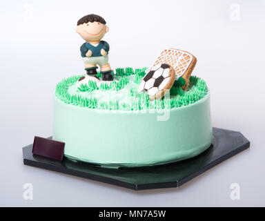 Kuchen oder Fußball-Kuchen auf einem Hintergrund Stockfoto