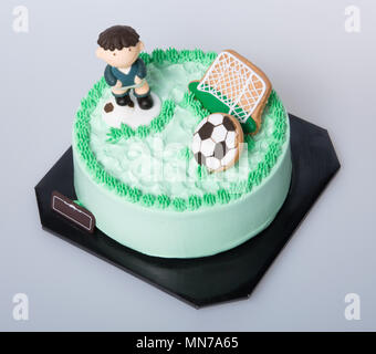 Kuchen oder Fußball-Kuchen auf einem Hintergrund Stockfoto