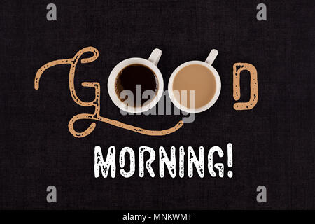 Guten Morgen Text auf schwarzen Tisch mit zwei Tassen Kaffee, die von oben, flach. Stockfoto
