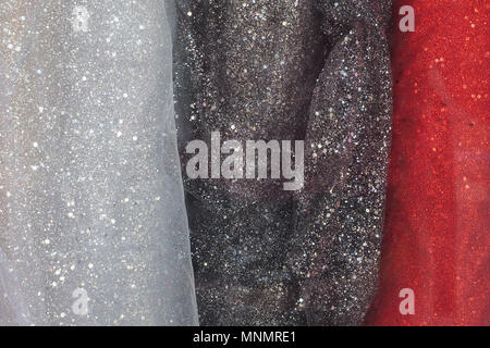 Zusammenfassung Hintergrund Textur der drei Strukturen Weiß, Schwarz und Rot mit Pailletten. Stockfoto