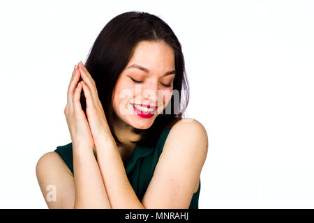 Emotionale junge Mädchen auf einem weißen Hintergrund, Studio, Beleuchtung Stockfoto