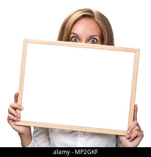 Schöne blonde Frau mit einer weißen Tafel. Stockfoto