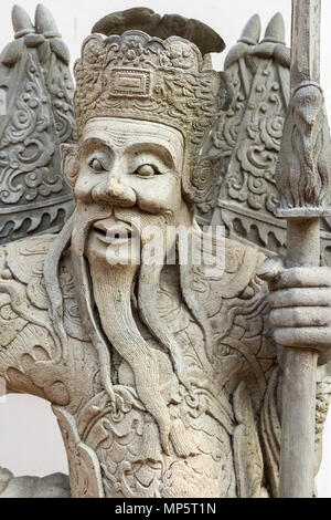 Das Gesicht eines Steinbildhauerei auf dem Gelände des Wat Pho (Tempel des Liegenden Buddha), oder Wat Phra Chetuphon Bangkok Thailand Stockfoto