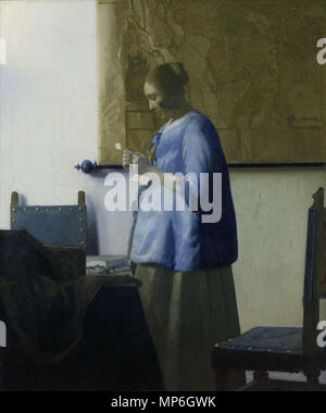 Frau liest einen Brief.[1] Alternative Titel (s): Frau in Blau lesen einen Brief ca. 1662-1663 (1647-1675). 1230 Vermeer, Johannes - Frau liest einen Brief - Ca. 1662-1663 Stockfoto