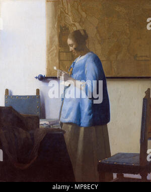 Frau in Blau Lesen einen Buchstaben zwischen 1663 und 1664. 730 Johannes Vermeer - Frau in Blau lesen einen Brief - WGA 24657 Stockfoto