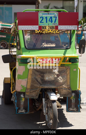 Eine grüne Motor Dreirad, Cagayan de Oro, Mindanao Stockfoto