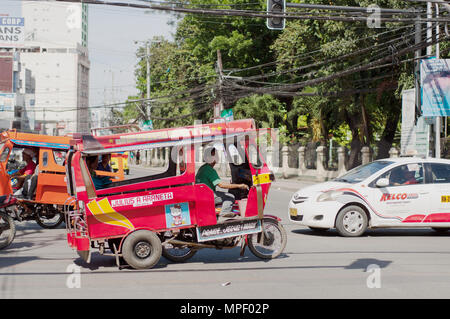 Ein roter Motor Dreirad, Cagayan de Oro Stockfoto