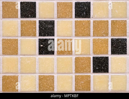 Multi-colored black orange brown and yellow square rough matte mosaic tiles, pattern seamless for decoration. seamless endless mosaic tile background  Stockfoto