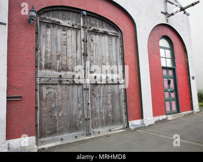 Port Chalmers, Dunedin, Neue Zealand-December 11,2016: gewölbte Fassade der Hafen Ställe Geschäft in der Innenstadt von Port Chalmers in Dunedin, Neuseeland Stockfoto