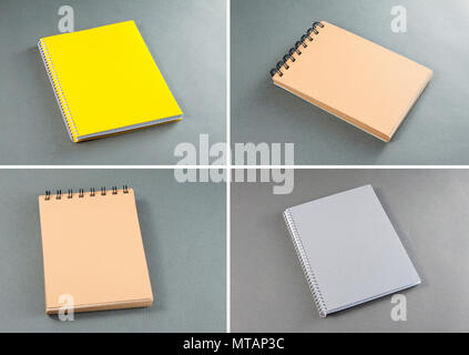Sammlung von Notebooks auf grauem Hintergrund Stockfoto