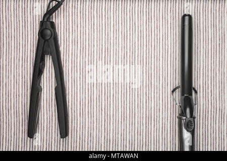 Haarglätter und einen Lockenstab Stockfoto