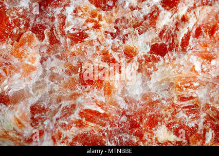 Mineral Calcit orange. Die Textur der Mineral. Makroaufnahmen von natürlichen Edelstein. Das rohe Mineral. Zusammenfassung Hintergrund. Stockfoto