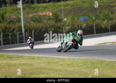 Ehemalige MotoGP-Weltmeister Nicky Hayden rittlings auf seinem Honda RCV factory Bike auf der offiziellen MotoGP winter Test in Sepang in Malaysia. Stockfoto