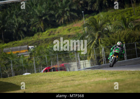 Ehemalige MotoGP-Weltmeister Nicky Hayden rittlings auf seinem Honda RCV factory Bike auf der offiziellen MotoGP winter Test in Sepang in Malaysia. Stockfoto