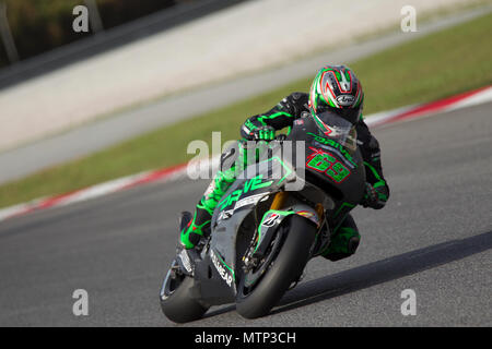 Ehemalige MotoGP-Weltmeister Nicky Hayden rittlings auf seinem Honda RCV factory Bike auf der offiziellen MotoGP winter Test in Sepang in Malaysia. Stockfoto