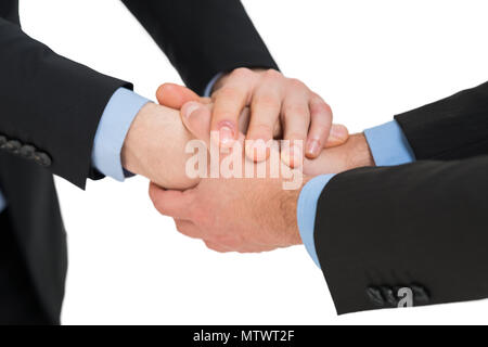 Geschäftsmann die Hilfe für einen anderen. Auf weiß Isoliert Stockfoto