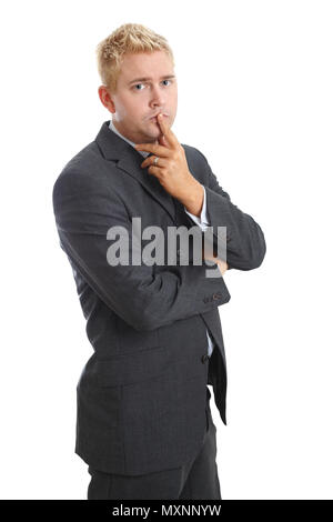 Junge Unternehmer mit den Finger auf den Mund schaut ernst und besorgt Stockfoto