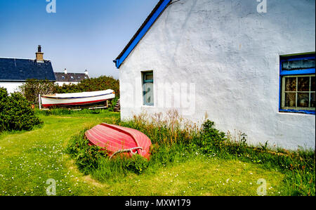 Easdale Island, die kleinste dauerhaft bewohnten Insel der Inneren Hebriden in Schottland. Die Gebäude auf der rechten Seite beherbergt das Museum der Insel. Stockfoto