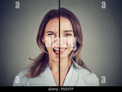 Bipolare Störung Konzept. Junge Frau mit einem Gesichtsausdruck auf grauem Hintergrund Stockfoto