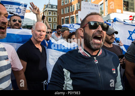 London, Großbritannien. 10 Juni, 2018. Pro-Israel Aktivisten Holding israelische Fahnen der pro-palästinensischen Al Quds Tag März durch das Zentrum von London von der Islamischen Menschenrechtskommission organisierte zu blockieren versuchen. Eine internationale Veranstaltung, Es begann 1979 im Iran. Quds ist der arabische Name für Jerusalem. Credit: Mark Kerrison/Alamy leben Nachrichten Stockfoto