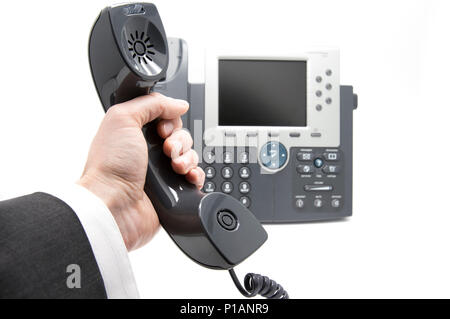 Geschäftsmann nimmt den Telefonhörer Stockfoto