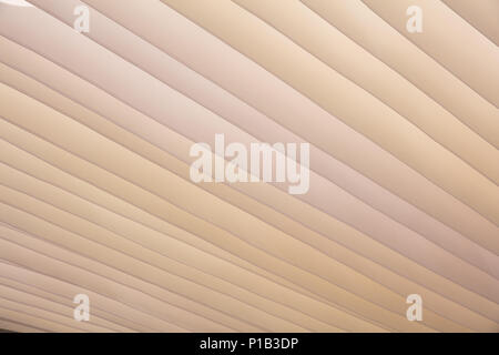 Sanddünen, Form und Farbe, Textur Hintergrund. Beige textil Dach für Sonnenschutz, wellenförmige Muster Stockfoto