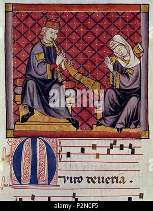 Spanish School. Cantigas de Santa Maria (Manuskript mit Musik Notationen): Albogon (oder al-bûq) und Tamburin Spieler. 13. Jahrhundert. Canticum, n° 300, Folio 368 V. Madrid, San Lorenzo de El Escorial Bibliothek. Autor: Alfons X. von Kastilien, der Weise (1221-1284). Lage: MONASTERIO - BIBLIOTECA - COLECCION, SAN LORENZO DEL Escorial, Madrid, Spanien. Stockfoto