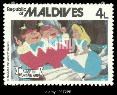 Republik Malediven - Stempel 1980: Colour Edition auf dem Walt Disney, zeigt Alice im Wunderland und märchenhafte Zeichen Stockfoto