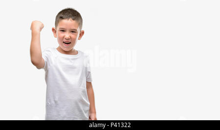 Dunkelhaarige kleine Kind genervt und frustriert schrie mit Zorn, verrückt und schreien mit erhobener Hand, Wut Konzept Stockfoto