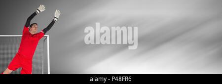 Fußball-Torwart speichern im Ziel mit Übergang Stockfoto