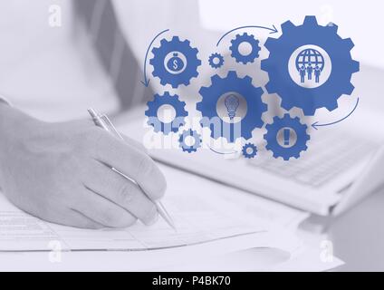 Das zusammengesetzte Bild der Mann bei der Arbeit mit digitalen Zahnräder Stockfoto