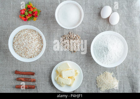 Zutaten für baking oatmeal Cookies auf einem hellen Hintergrund. Bild mit einem Bild von oben Stockfoto