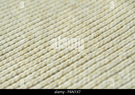 Fabric Textur einer sanften Gelb gestrickte Pullover. Makro Bild der Struktur der Bindungen in Garnen. Stockfoto