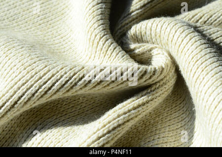 Fabric Textur einer sanften Gelb gestrickte Pullover. Makro Bild der Struktur der Bindungen in Garnen. Stockfoto
