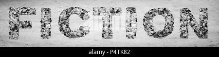 Das Wort Fiktion von der Zeitung Konfetti auf altem Papier Stockfoto