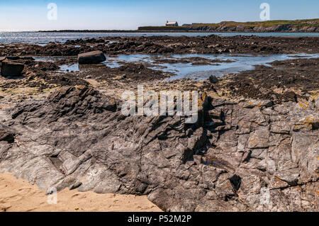 North Wales. Cwyfan Kirche auf seine Gezeiten Cribinau Insel Anglesey. Stockfoto