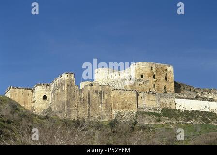 SIRIA. KRAK DE LOS CABALLEROS. Castillo erigido en el siglo XII por los caballeros hospitalarios, durante las Cruzadas ein Tierra Santa. En el siglo XIII cayó en Manos árabes. Vista allgemein. Stockfoto