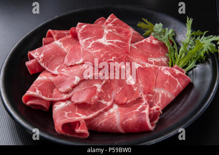 Hammel rollt auf einem Teller. Stockfoto