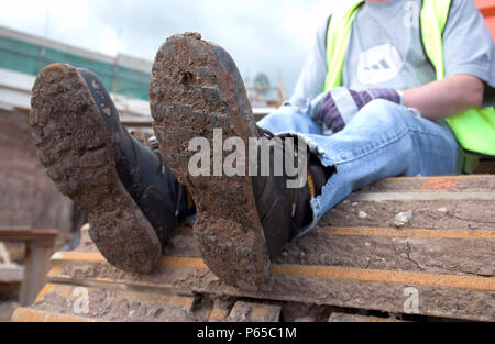 Bauarbeiter genießen eine Pause vor Ort Stockfoto