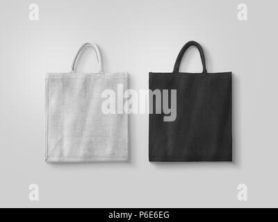 Leerer weißer und schwarzer Baumwolle eco Bag Design mockup isoliert, freistellungspfaden. Textil Tuch kunden Tasche mock up Vorlage. Tote schuh Verbraucher wieder verwendbare organische Handwerk Paket. Träger recyceln grossery Tasche Stockfoto