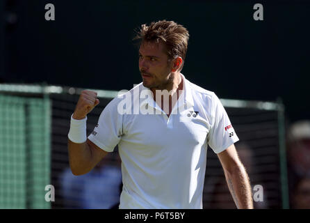 Stan Wawrinka reagiert während seines Spiels am ersten Tag der Wimbledon Championships beim All England Lawn Tennis and Croquet Club in Wimbledon. Stockfoto