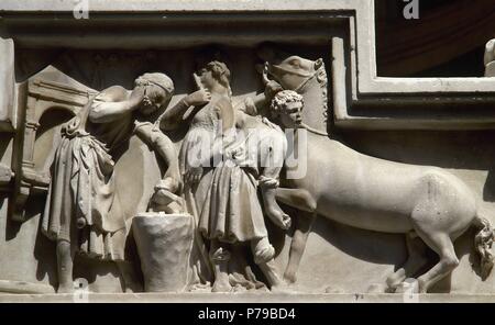 Italien. Florenz. Orsanmichele oder Gemüsegarten der St. Michael Kirche. Reliefs des Büros gewidmet. Hufschmiede. Von außen. Stockfoto