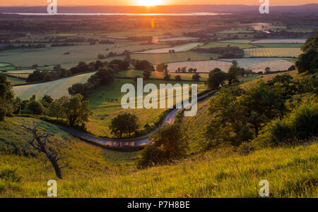 Sonnenuntergang Blick von Coaley Peak, in der Nähe von Stroud schauen über den Severn Vale Stockfoto