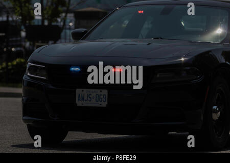 Polizeieskorte Schließen der Canada Day Parade Feier im Hafen Credit, Ontario, Kanada Stockfoto