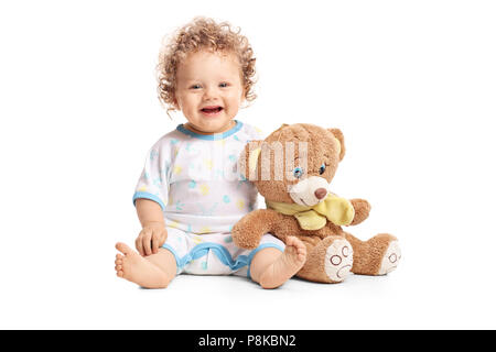 Baby Boy mit einem Teddybär auf weißem Hintergrund Stockfoto