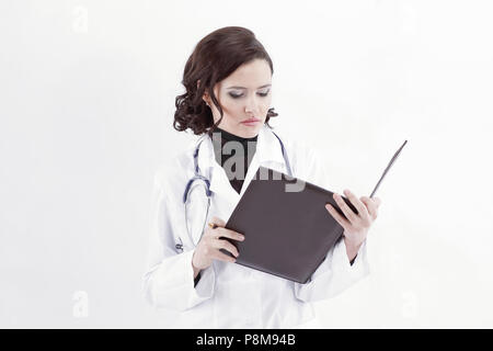 Ärztin Notizen in die Gesundheitsakte. Stockfoto