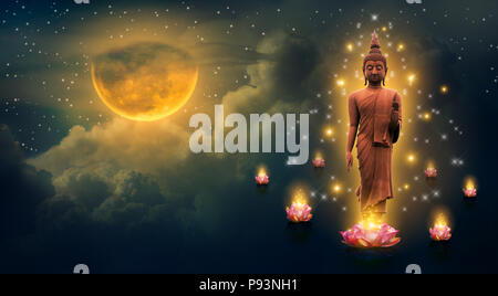 Buddha standing on a lotus in the sky at night The big moon is the background Stockfoto