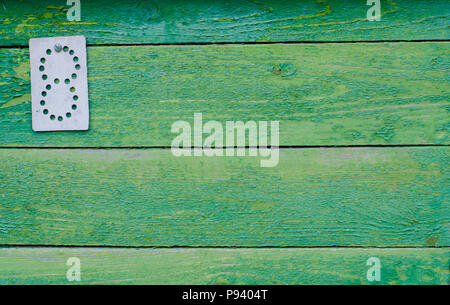Grün lackierte Bretter mit einer Art Blech in der Ecke. Holz Textur mit natürlichen Muster. Stockfoto