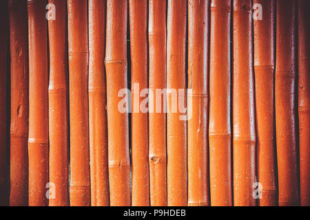Vintage orange Holz Bambus Wand Hintergrund Stockfoto